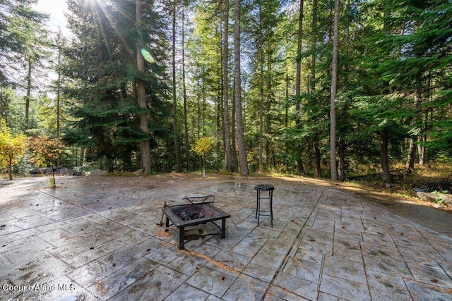 view of patio featuring a fire pit