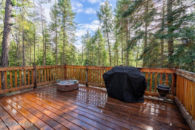 wooden terrace with area for grilling