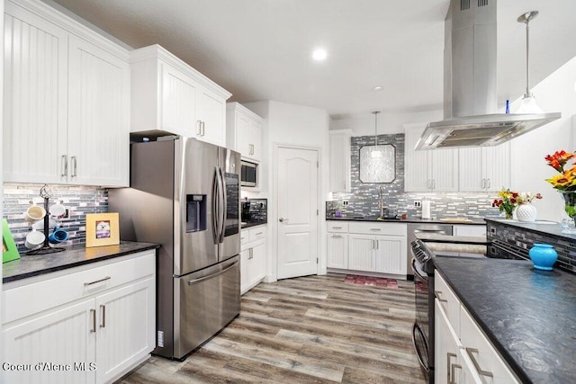 kitchen with white cabinetry, island exhaust hood, stainless steel appliances, and pendant lighting