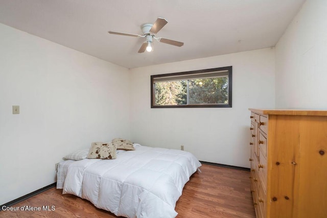 905 S Tanglewood Rd, Post Falls, ID 83854 - bedroom featuring wood finished floors, ceiling fan, and baseboards