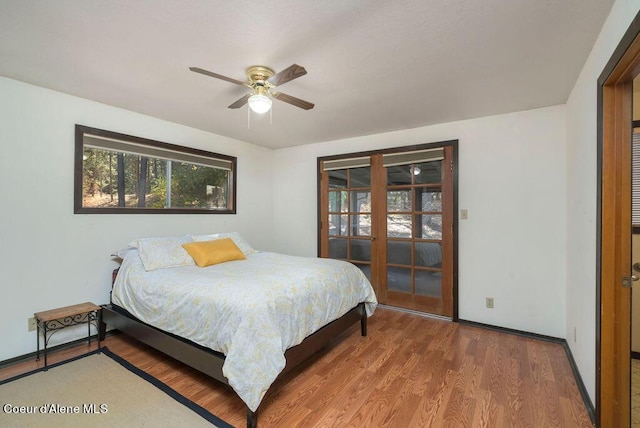 905 S Tanglewood Rd, Post Falls, ID 83854 - bedroom featuring wood finished floors, baseboards, and a ceiling fan