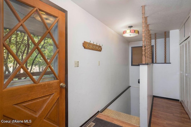 905 S Tanglewood Rd, Post Falls, ID 83854 - hallway with a heating unit, wood finished floors, and baseboards