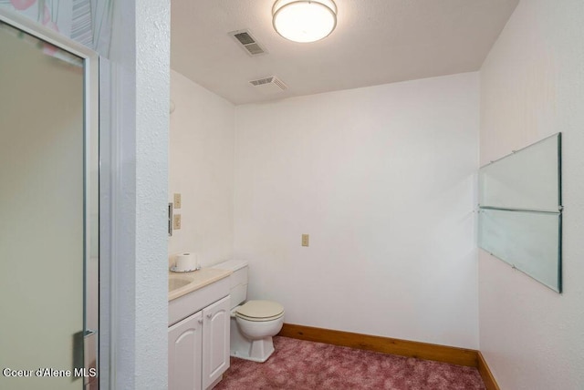 905 S Tanglewood Rd, Post Falls, ID 83854 - bathroom with vanity, toilet, and baseboards