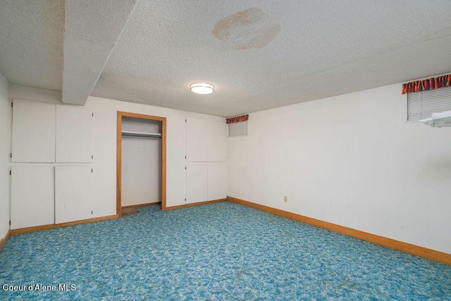 905 S Tanglewood Rd, Post Falls, ID 83854 - unfurnished bedroom featuring baseboards, carpet flooring, a textured ceiling, and a closet