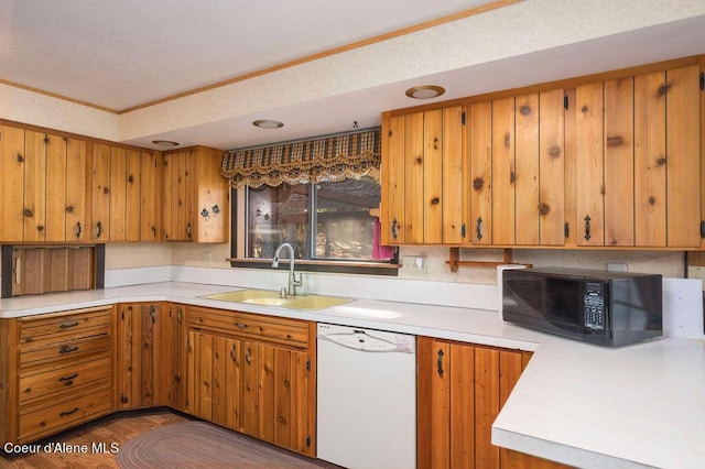 905 S Tanglewood Rd, Post Falls, ID 83854 - kitchen with white dishwasher, black microwave, a sink, light countertops, and crown molding