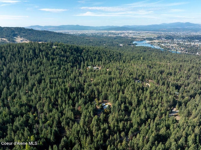 905 S Tanglewood Rd, Post Falls, ID 83854 - view of property location featuring a mountainous background and a heavily wooded area