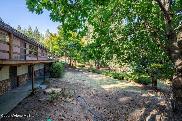 905 S Tanglewood Rd, Post Falls, ID 83854 - view of yard featuring a wooden deck