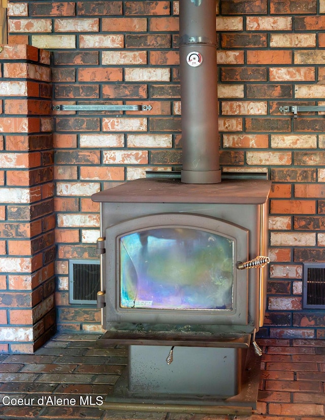 905 S Tanglewood Rd, Post Falls, ID 83854 - detailed view of brick wall and a wood stove