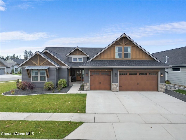 craftsman-style home with a front yard and a garage