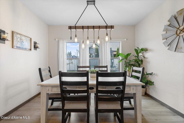 dining space featuring light hardwood / wood-style flooring