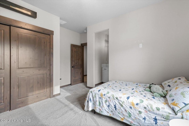 carpeted bedroom featuring a closet