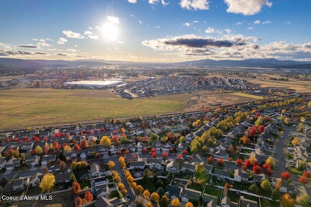 aerial view at dusk featuring a mountain view