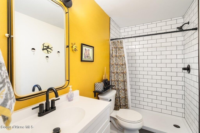 bathroom with vanity, toilet, and a shower with shower curtain