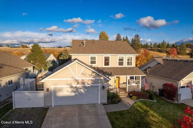 view of front of house featuring a front yard and covered porch