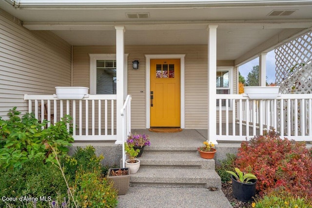 entrance to property featuring a porch