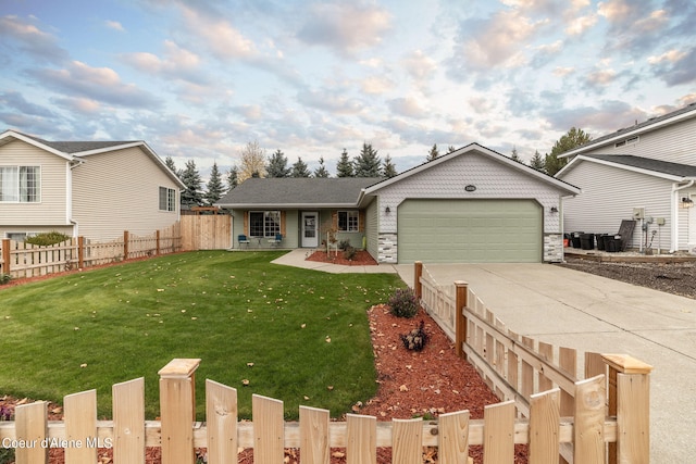 view of front of house featuring a front yard and a garage