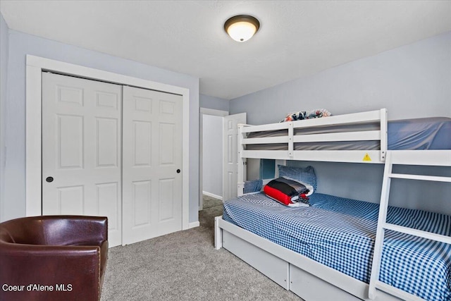 bedroom with a closet and carpet floors