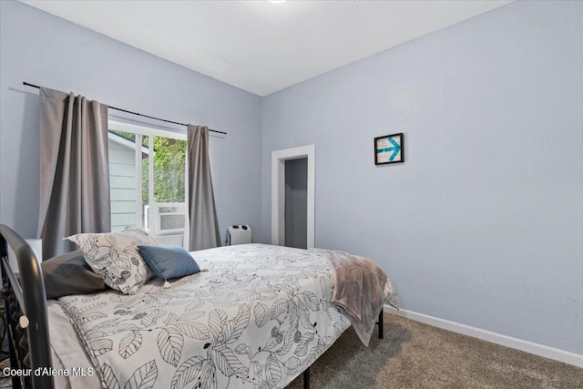 bedroom with cooling unit and carpet floors