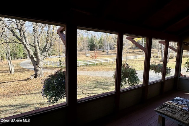 unfurnished sunroom with a rural view