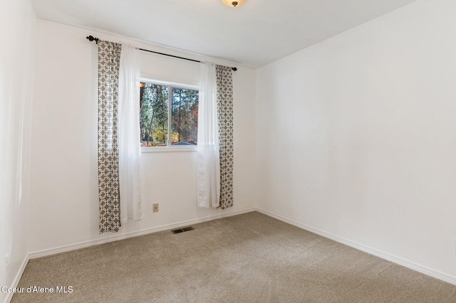 unfurnished room featuring carpet