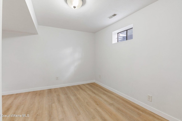 basement featuring light wood-type flooring