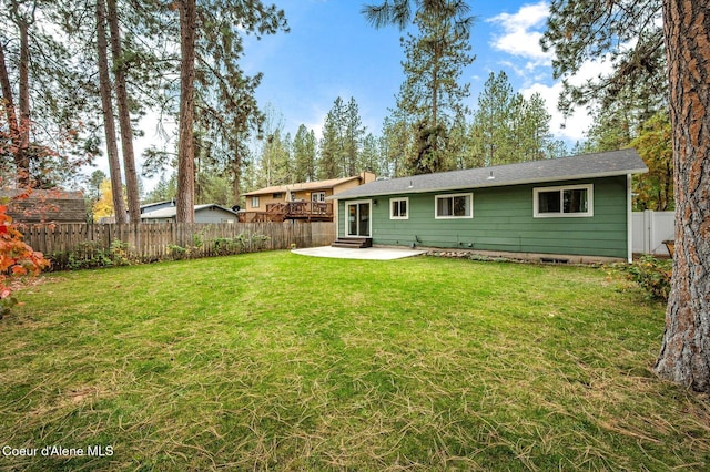 rear view of property with a patio area and a lawn