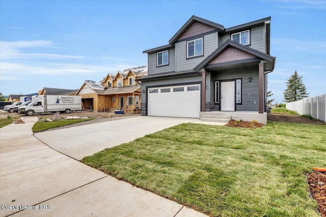 2711 E Cinder Ave, Post Falls, ID 83854 - view of front of property featuring driveway, an attached garage, and stone siding
