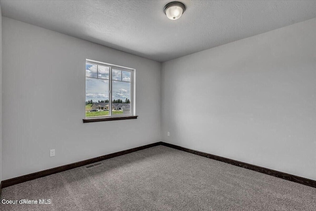 2711 E Cinder Ave, Post Falls, ID 83854 - carpeted spare room featuring baseboards and a textured ceiling