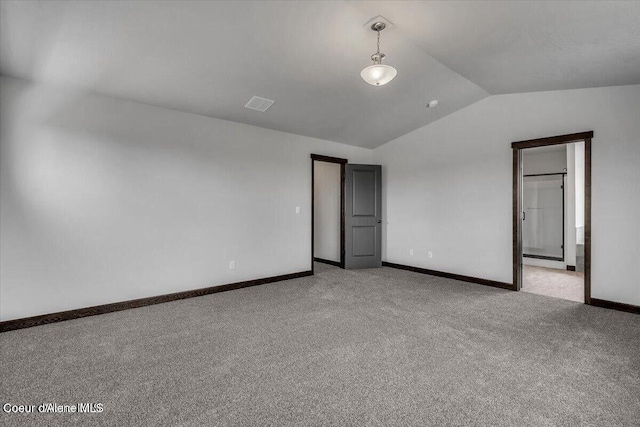 2711 E Cinder Ave, Post Falls, ID 83854 - unfurnished bedroom with vaulted ceiling, carpet flooring, and baseboards