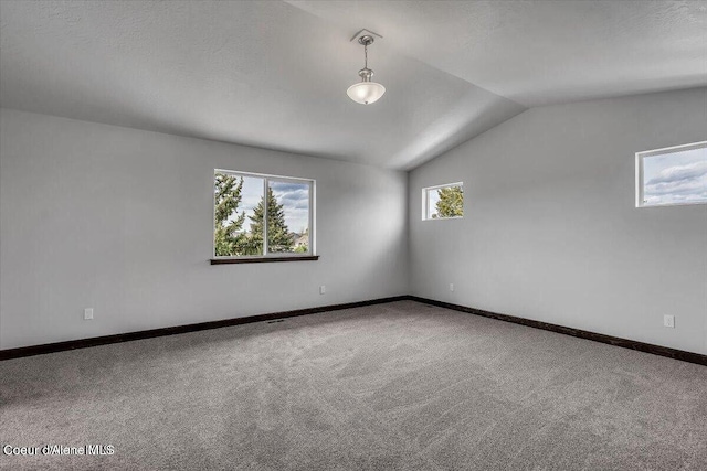2711 E Cinder Ave, Post Falls, ID 83854 - carpeted spare room with lofted ceiling and baseboards