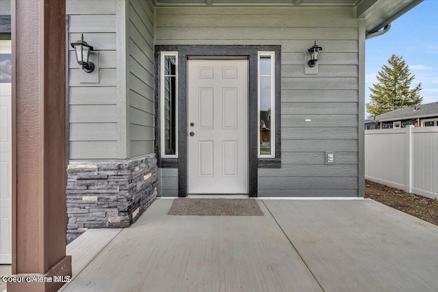2711 E Cinder Ave, Post Falls, ID 83854 - entrance to property featuring fence and stone siding