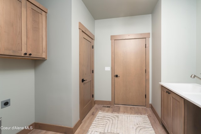 11996 N Rocking R, Hayden, ID 83835 - laundry area with cabinet space, hookup for an electric dryer, and light wood-style floors