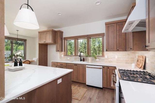11996 N Rocking R, Hayden, ID 83835 - kitchen featuring white dishwasher, ventilation hood, gas stove, and decorative backsplash
