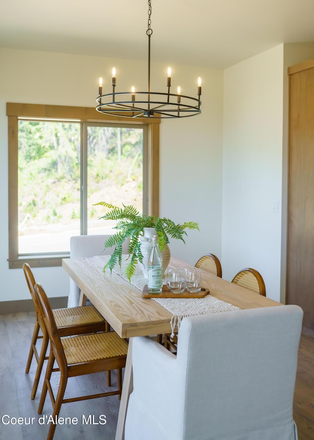 11996 N Rocking R, Hayden, ID 83835 - dining room featuring a chandelier and wood finished floors