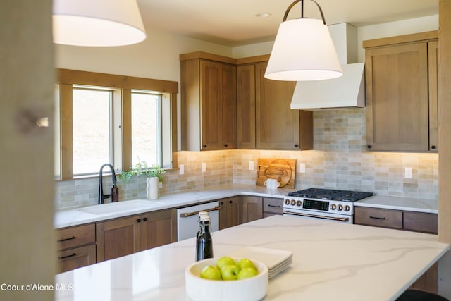 11996 N Rocking R, Hayden, ID 83835 - kitchen featuring stainless steel range, dishwasher, backsplash, pendant lighting, and light stone countertops
