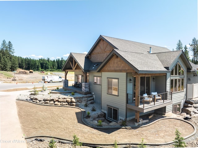 11996 N Rocking R, Hayden, ID 83835 - back of property featuring roof with shingles and covered porch