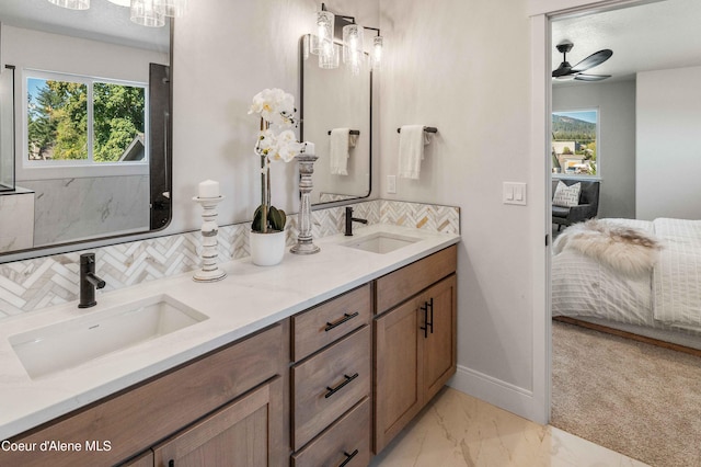 bathroom featuring vanity, decorative backsplash, a textured ceiling, and ceiling fan