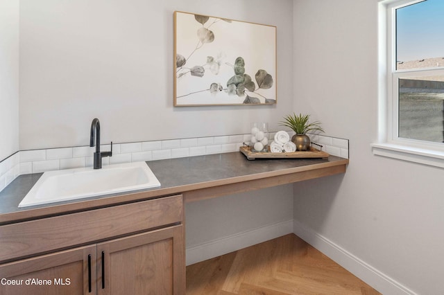 interior space with vanity and parquet floors