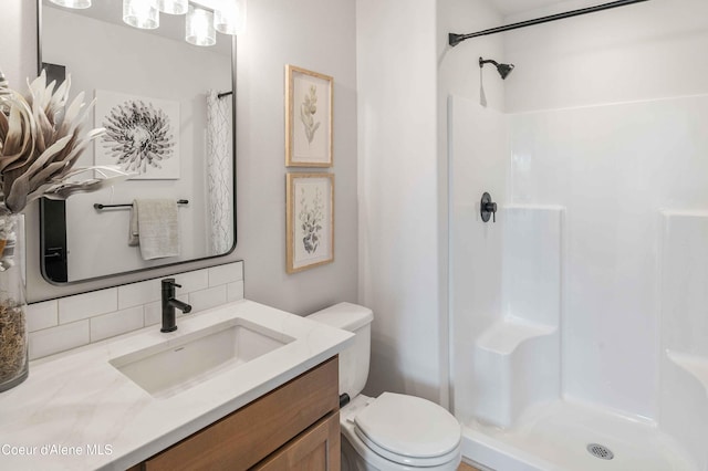 bathroom with vanity, toilet, and a shower with shower curtain