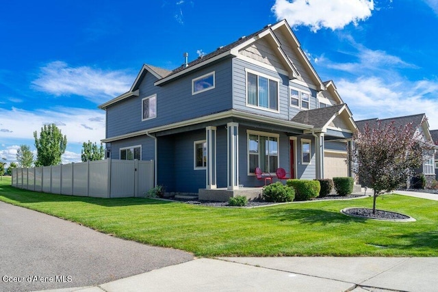 view of front of house with a front yard and covered porch