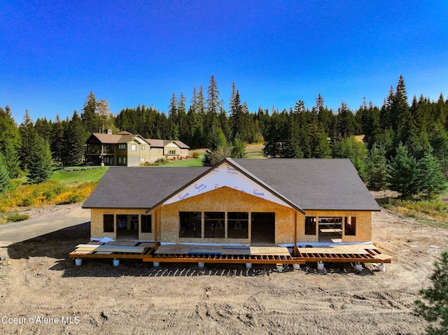 rear view of house with a wooden deck