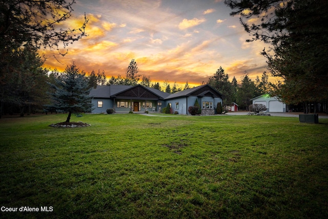 view of front of house with a lawn and a garage