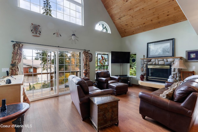 296 Ullr Dr, Sandpoint, ID 83864 - living area with a fireplace, wood finished floors, high vaulted ceiling, and wooden ceiling