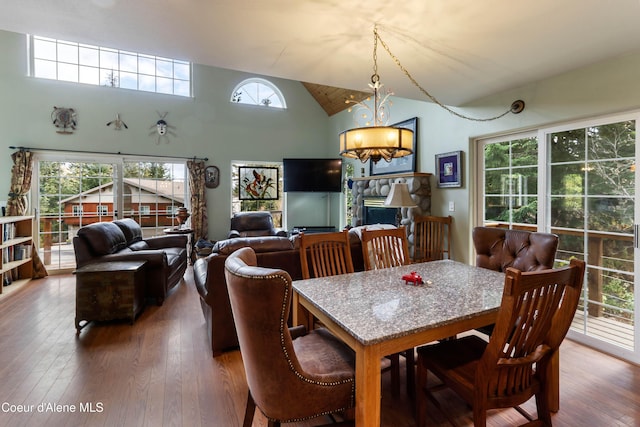 296 Ullr Dr, Sandpoint, ID 83864 - dining area featuring high vaulted ceiling and hardwood / wood-style floors