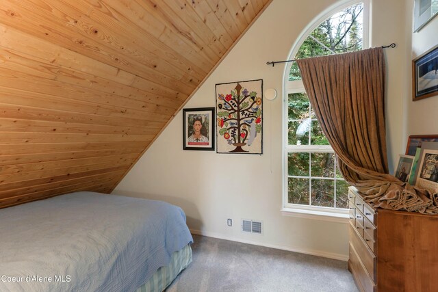 296 Ullr Dr, Sandpoint, ID 83864 - bedroom featuring visible vents, baseboards, wood ceiling, carpet flooring, and vaulted ceiling