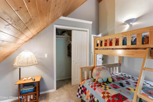296 Ullr Dr, Sandpoint, ID 83864 - carpeted bedroom featuring wood ceiling, a closet, and lofted ceiling