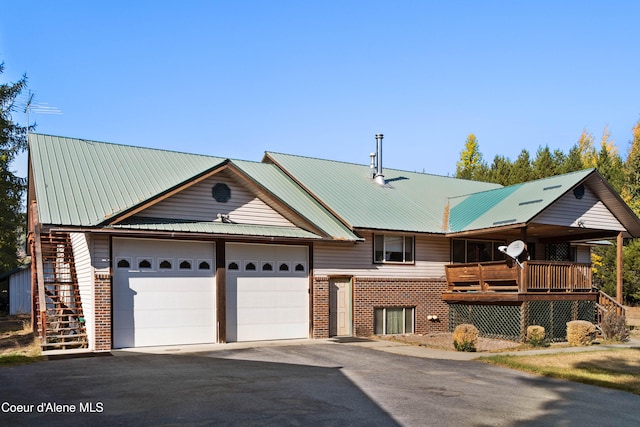 view of front of home with a porch and a garage