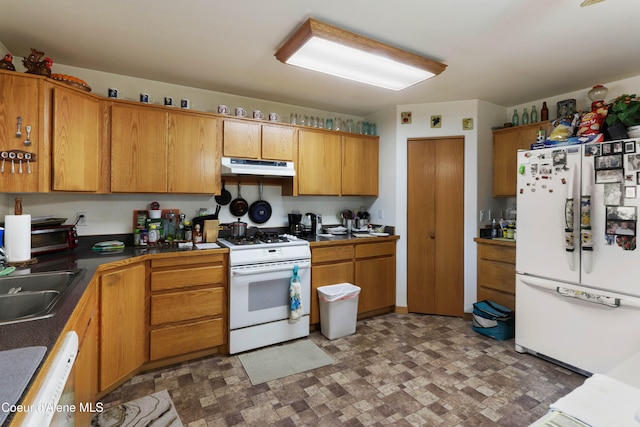 kitchen with sink and white appliances