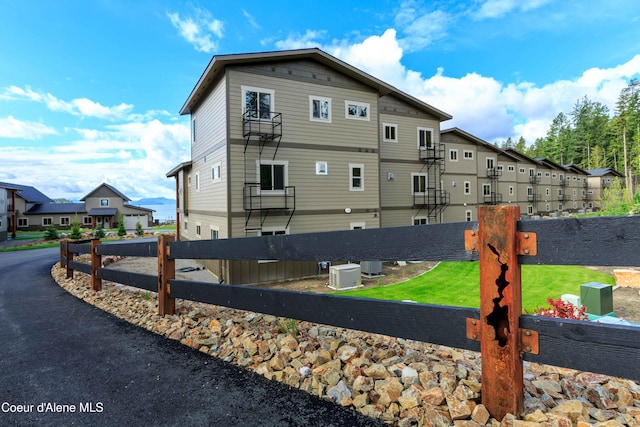 view of side of property with central AC unit