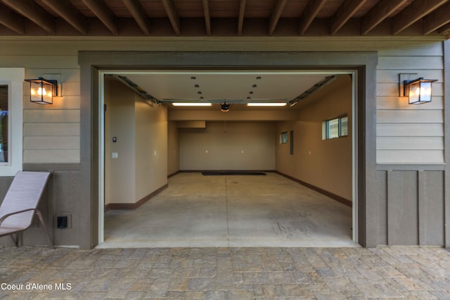 garage featuring wooden walls